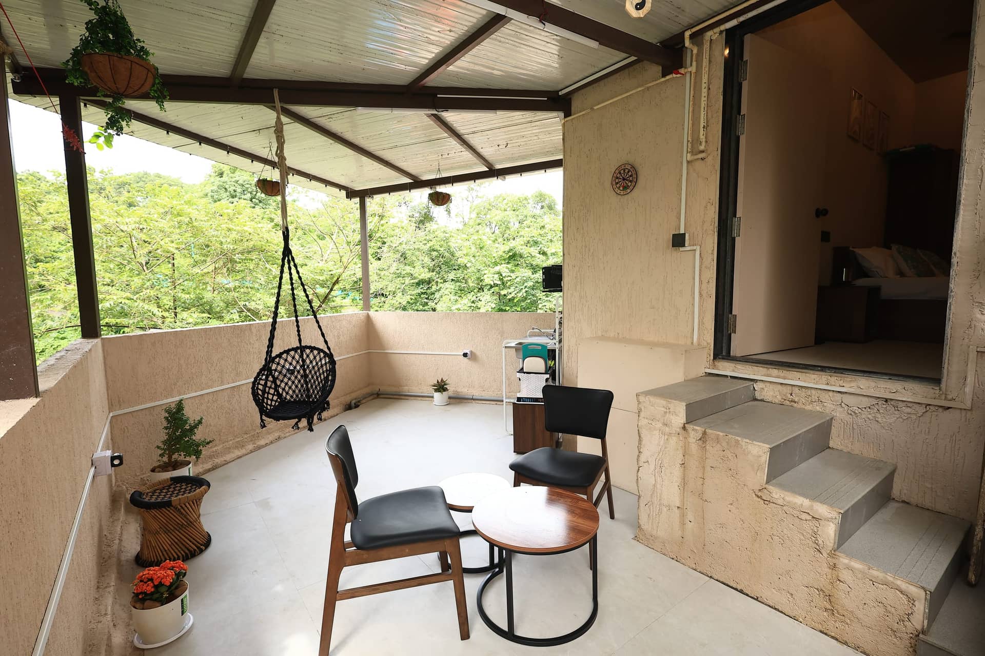 Hinata's covered terrace overlooking green trees