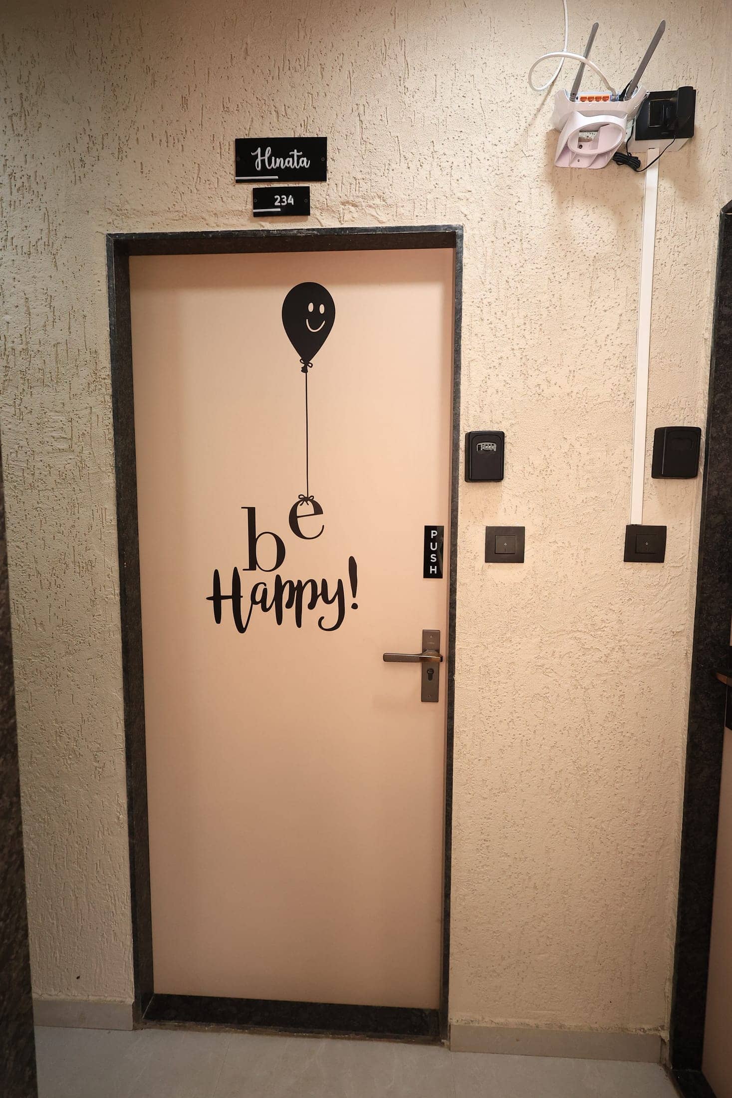 Ojani's cheerful illustrated entrance door