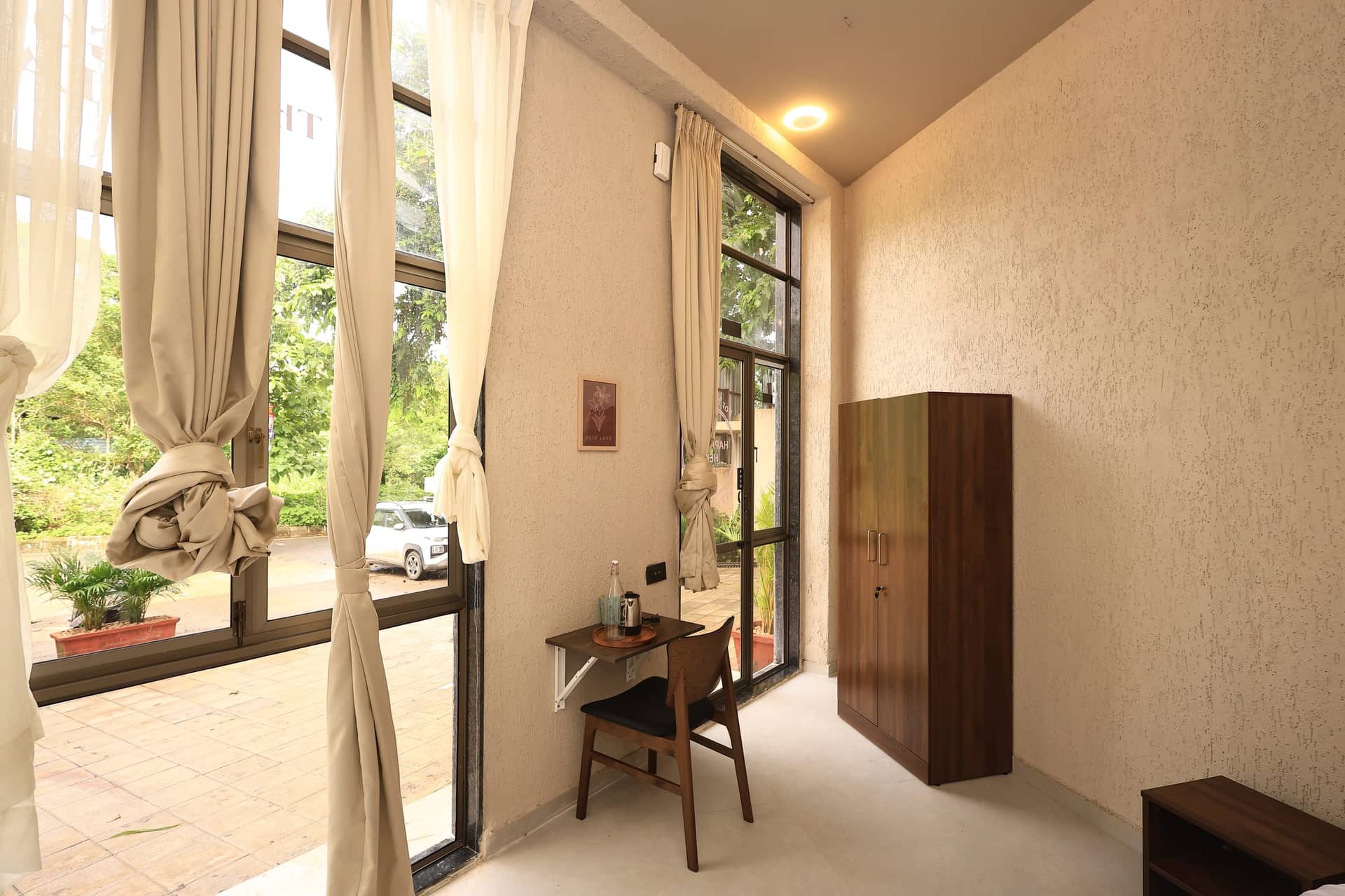 Raku studio with soaring windows opening to the garden